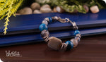 Load image into Gallery viewer, bhavaa Premium Gemstone Jewelry- Bracelet. Products Serene Indulgence Collection, Mark-2 | Gemstones: Grey Fire Crackle Agate Faceted, Grey Brazilian Aquamarine Faceted, Blue Banded Agate Faceted, Grey Imperial Jasper (rare), Blue Banded Agate Faceted
